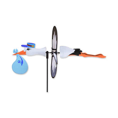 Decorative yard spinner of a stork delivering a baby boy
