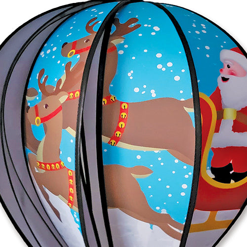 Close up of spinning hot air balloon with Santa Claus and flying reindeer design