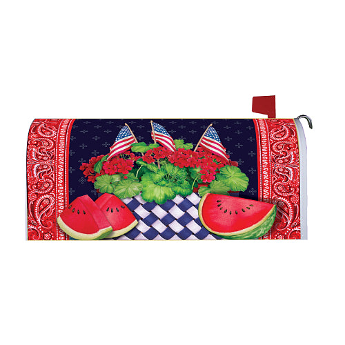 Mailbox cover with watermelon slices, American flags, red geraniums and a bandana design on a black background.