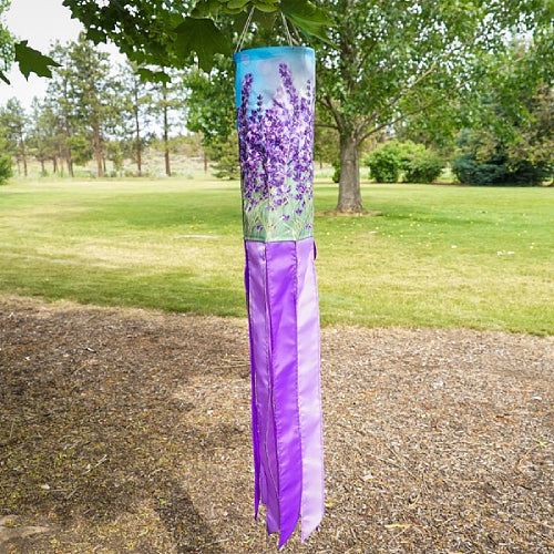 Decorative windsock with lavender design hanging outdoors.