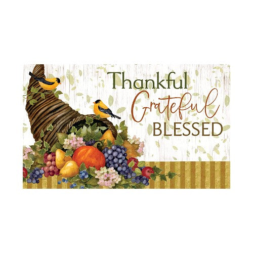 Decorative indoor outdoor doormat with cornucopia, fruits, and birds on a white background