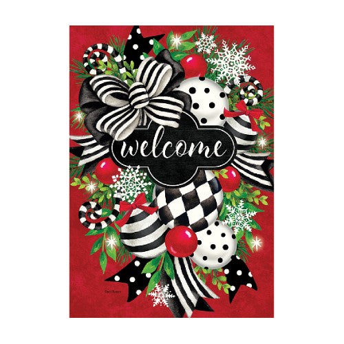 Decorative Christmas-themed 'welcome' flag with black and white checkered and polka dot patterns on a red background.