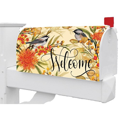 Large, decorative mailbox cover featuring birds, flowers, and the word 'Welcome'.