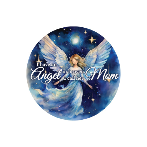 A circular graphic featuring a painted angel with large white wings against a deep blue starry night sky. White script text across the center reads, 'I have an Angel in heaven, I call her Mom.