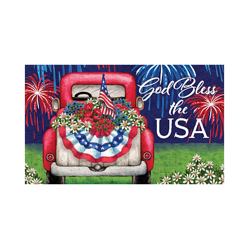 Decorative flag with a red truck, American flag, flowers, and 'God Bless the USA' text against a fireworks background.