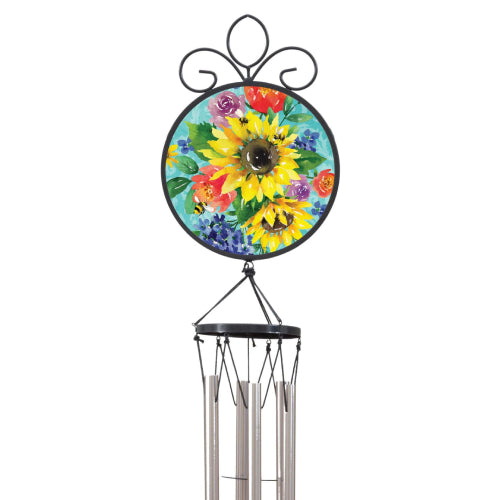 A wind chime featuring a circular metal top with an interchangeable Suncatcher, hanging from a black scrollwork top and silver metal tubes.