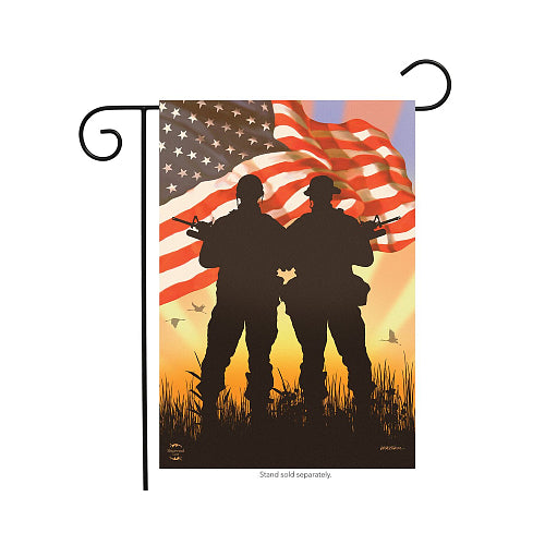 Decorative flag with silhouettes of two soldiers holding rifles against an American flag and sunset background.