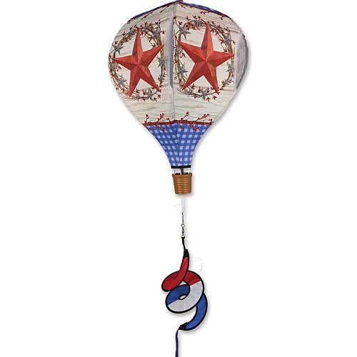 Decorative hot air balloon with red stars and blue checkered pattern
