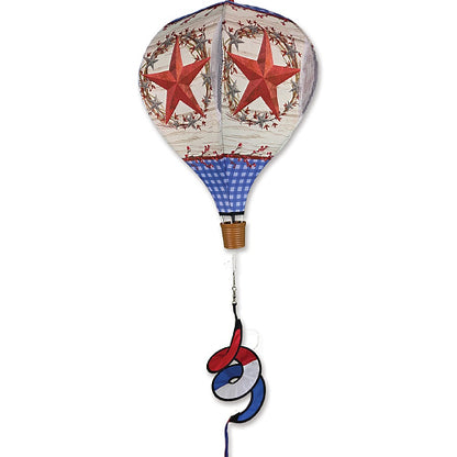 Decorative hot air balloon with red stars and blue checkered pattern