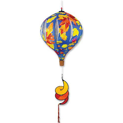 Colorful hot air balloon windsock with autumn leaf design on a white background