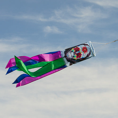 Día de los Muertos (Sugar Skull) windsock against a blue sky