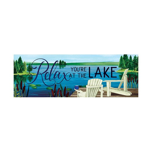 Decorative sign with 'Relax You're at the Lake' text and Adirondack chairs by a lake.
