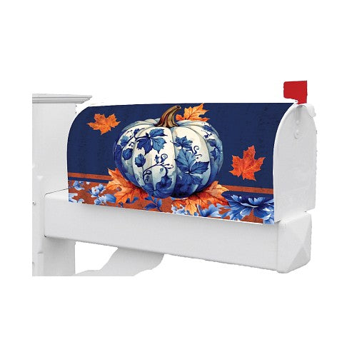 Decorative fall mailbox cover featuring a blue pumpkin and orange leaves on a white background