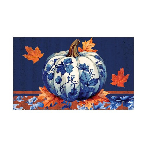 Decorative pumpkin with blue floral patterns on a blue background with orange leaves