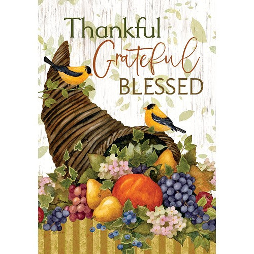 Decorative sign with birds, fruits, and flowers on a wooden background with 'Thankful', 'Grateful', 'Blessed' text.