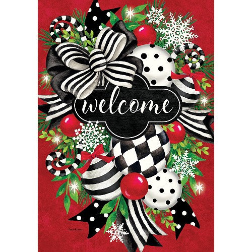 Decorative Christmas-themed 'welcome' flag with bows, candy, and snowflakes on a red background.