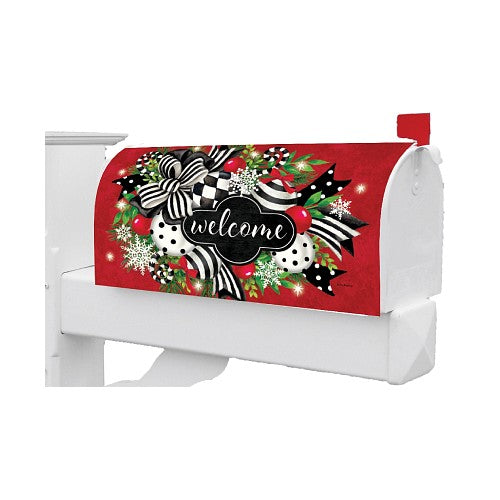 Decorative Christmas cover featuring black and white polka dots, bows, and snowflakes with the word 'welcome'.