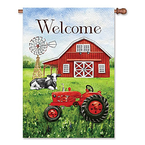 Standard size house flag displayed on a pole, featuring a illustration of a red barn, vintage red tractor, black and white Holstein cow, and windmill on a lush green field with the word "Welcome" in dark lettering at the top.