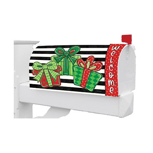 Decorative mailbox cover with Christmas-themed design featuring bows and presents on a black and white striped background.