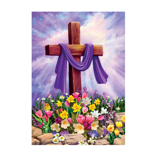 Cross with purple cloth surrounded by colorful flowers against a purple sky