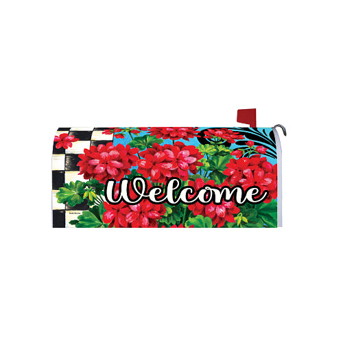 Mailbox cover with red flowers and 'Welcome' text on a blue background and black and white checks on the left side