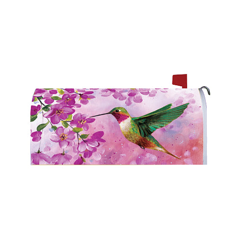 Mailbox cover with a colorful hummingbird and pink flowers on a pink and white background