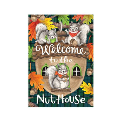 A decorative sign or print featuring three illustrated squirrels around a nut house with the words 'Welcome to the Nut House.' The design includes autumn leaves, and acorns
