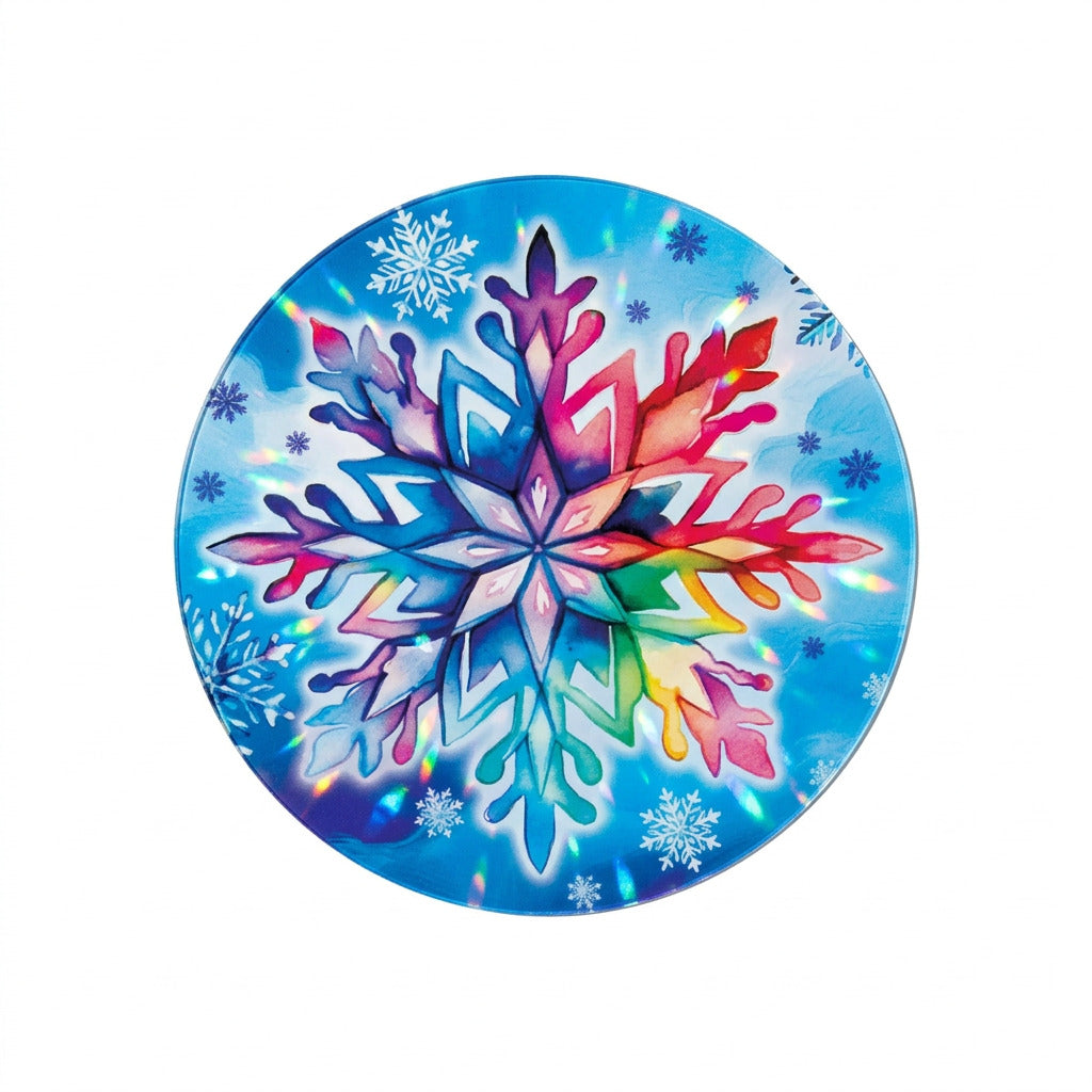 Round Let It Snow suncatcher featuring a large rainbow-colored snowflake surrounded by smaller white and blue snowflakes on a bright blue background. 
