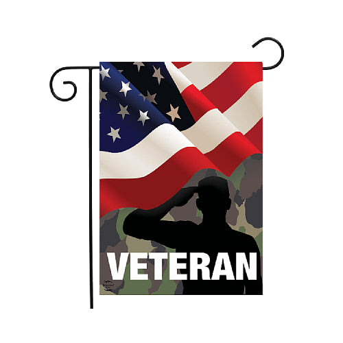 Waving American flag and silhouette of a veteran saluting