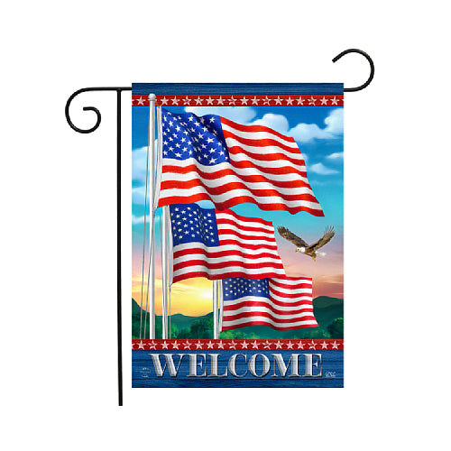Decorative flag with American flags and an eagle, featuring the word 'Welcome', on a blue sky background.