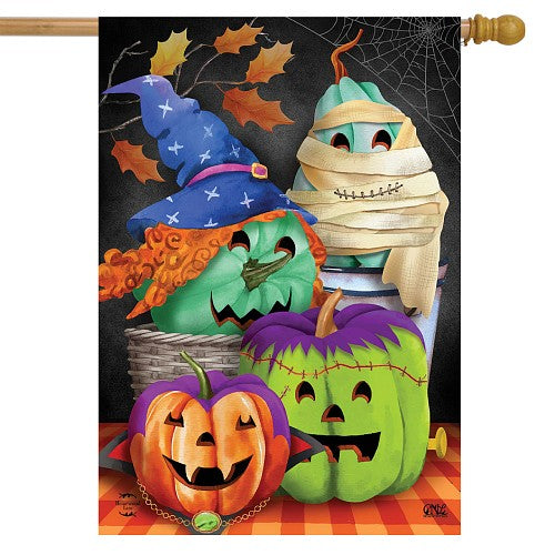 Decorative Halloween flag with pumpkins, witch hat, and mummy design on a black background.