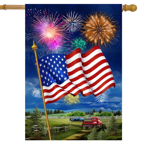 American flag with fireworks and a truck in the background