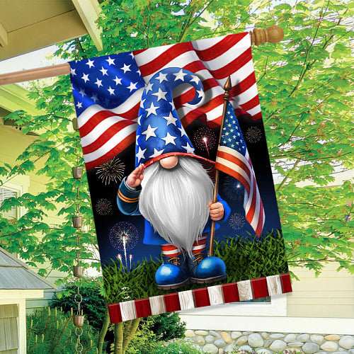 Decorative flag with a gnome holding an American flag against a green outdoor background